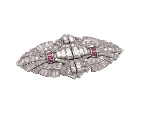 A mid 20th century diamond and ruby double clip brooch, the shaped geometric panels, the pierced radiating panels set with br
