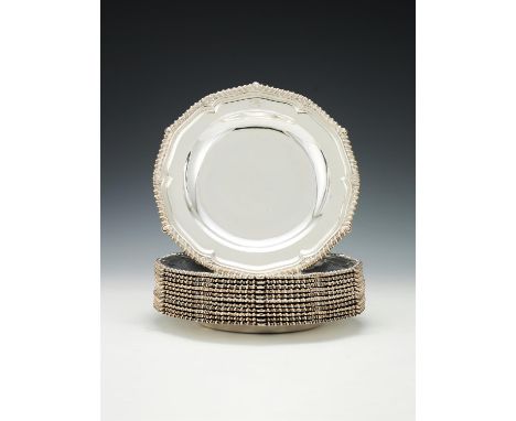 A set of twelve late George III silver hexafoil soup plates by Paul Storr, London 1813, numbered 982, the gadrooned rim with 