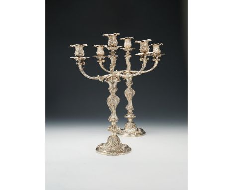 A pair of Victorian silver three light candelabra by Robert Garrard II, London 1848, with detachable foliate sconces, leaf an