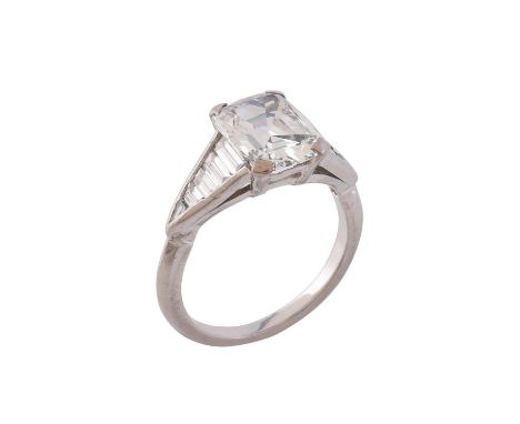 A single stone diamond ring, the mixed cut diamond weighing 2.67 carats, between step cut diamond set shoulders, approximatel