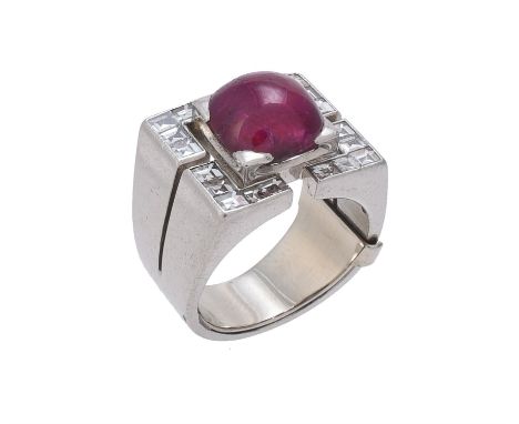 A French mid 20th century Burma ruby and diamond dress ring, the cushion shaped cabochon ruby estimated to weigh 5.20 carats,