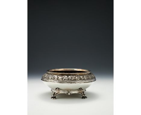An Edwardian Arts and Crafts hammered silver rose bowl by Omar Ramsden & Alwyn Carr, London 1909, engraved 'Omar Ramsden Et A