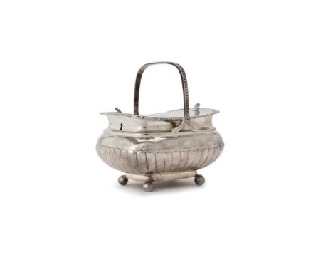A George III silver oblong twin compartment tea caddy by Daniel Pontifex, London 1808, with a nulled fixed handle over, a flu