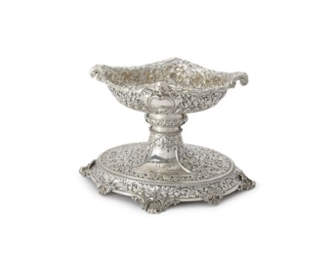 A late Victorian silver oval table centrepiece by Horace Woodward & Co. Ltd., London 1895, embossed with flowering scroll fol