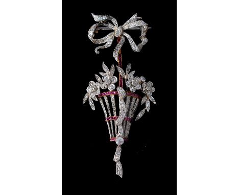 A Belle Époque diamond and ruby basket brooch, circa 1910, the pierced basket set with rose cut diamonds, with curved bands o