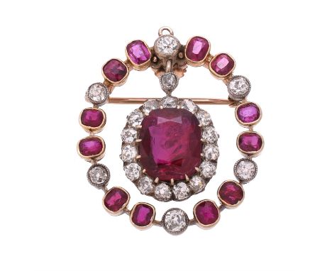 A late Victorian and later ruby and diamond brooch/pendant, centred with a late Victorian old mine cut diamond and ruby clust