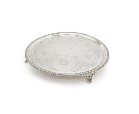 A Victorian silver circular salver by Goldsmiths Alliance Ltd. (Samuel Smily), London 1874, with a raised guilloche rim, a pi