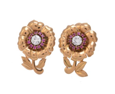 A pair of French 1940s Retro ruby and diamond flower ear clips, the polished gold coloured flower heads each centred with an 