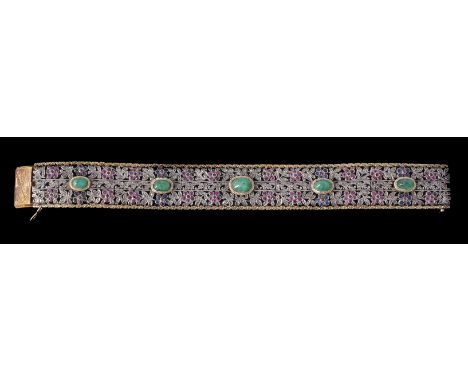 A 1930s Italian diamond, sapphire, emerald and ruby bracelet, the gold and silver broad pierced panels with polki diamond set