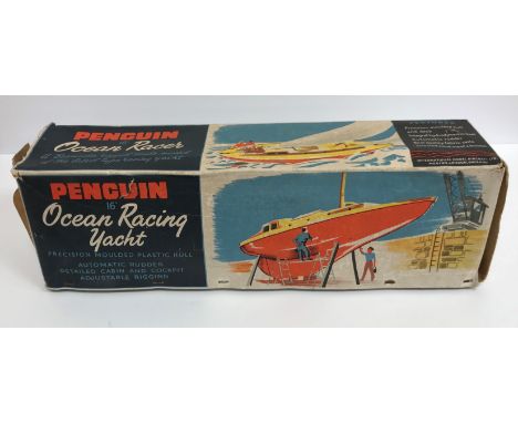 A Milbro products Ailsa yacht model sailboat, together with a Penguin 16" ocean racing yacht model, boxed, a Tonka dump truck