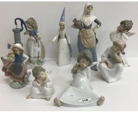 A collection of twelve Lladro figures including "Girl at pump with geese", "Two nuns", two figures of "Girls with parasols", 