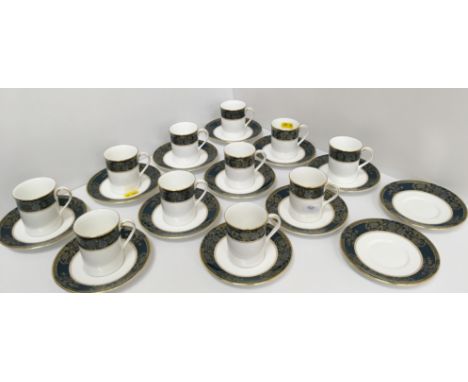 A set of eleven Royal Doulton "Carlyle" pattern coffee cans and thirteen saucers together with a Royal Worcester "Sandringham