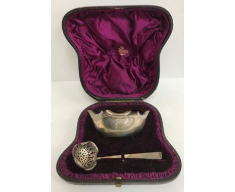 A Victorian cased silver sugar bowl and sifter spoon (by Jonathon Wilkinson Hukin and John Thomas Heath, London 1884), (the s