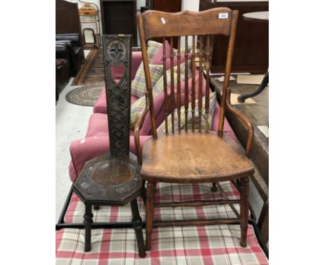 A circa 1900 oak stick back panel seat chair in the American style and a carved oak spinning chair