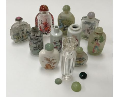 A Chinese rock crystal scent bottle of tapering cylindrical form, the neck decorated with three elephant heads and rings (one