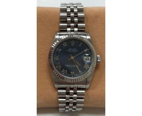 A Rolex Oyster Datejust wristwatch with seal, case and bracelet, No'd. 631102 to bracelet, with blue dial and set with Roman 