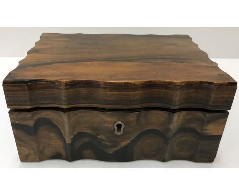 A circa 1900 Anglo-Indian coromandel and ivory inlaid workbox, the shaped top opening to reveal an elephant inlaid panel and 