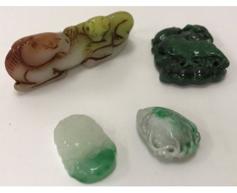 A Chinese carved hard stone figure group as "A monkey upon the back of a horse", 8 cm x 3.3 cm, a carved jade pendant as "A p