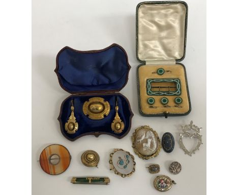 A cased set of green and white enamelled shirt studs, belt buckle and pin, together with a Victorian pinchbeck brooch of Clas