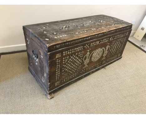 A 19th Century Moorish shallow dome top trunk with mother of pearl and ebony parquetry work inlaid decoration, the medallion 