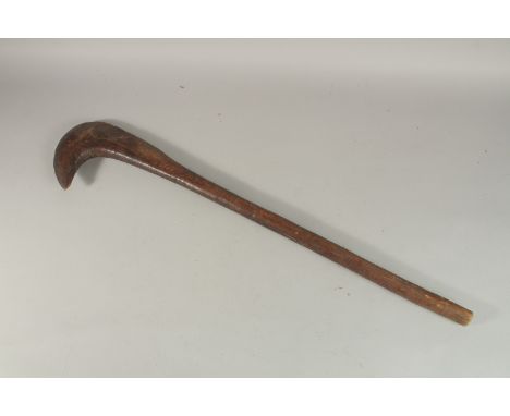 AN AFRICAN WOODEN AXE TYPE CLUB.