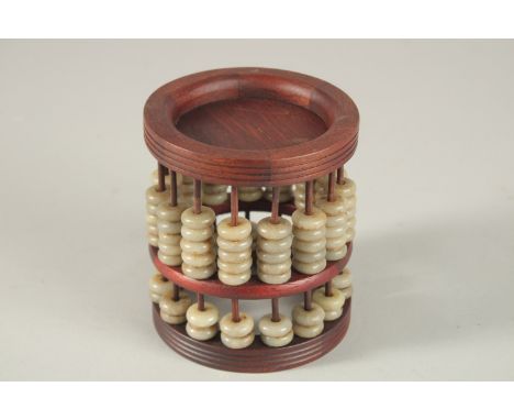 A WOODEN JADE ABACUS.