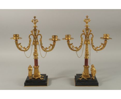 A SUPERB PAIR OF CLASSICAL GILT BRONZE AND MARBLE TWO-LIGHT CANDLESTICKS with curving branches on square black marble bases. 