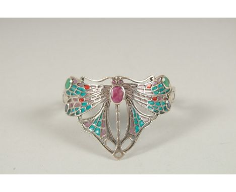 A SILVER RUBY, EMERALD AND SAPPHIRE DRAGONFLY BANGLE.