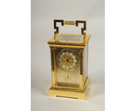 A GOOD GILT BRONZE REPEATING CARRIAGE CLOCK with alarm. 14cms high.