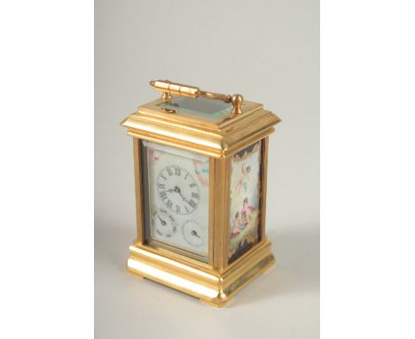 A SMALL BRASS CARRIAGE CLOCK with three dials and Sevres design porcelain panels to the sides. 8cms high.