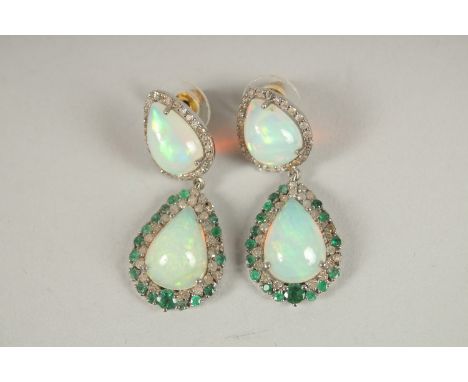 A SILVER AND GOLD PAIR OF OPAL, EMERALD AND DIAMOND DROP EARRINGS.