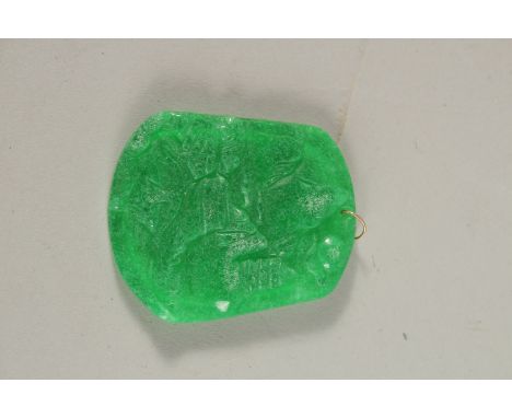 A GOLD RING TOP JADE PENDANT.