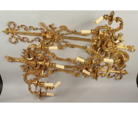 A GOOD PAIR OF LARGE FOUR-LIGHT GILT BRONZE WALL SCONCES with ribbon motifs, masks and acanthus. 120cms high.