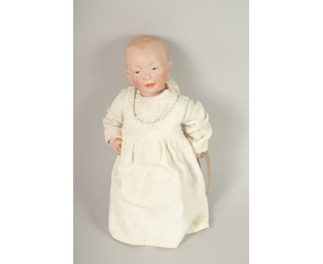 A KAMMER &amp; REINHARDT, GERMAN, CIRCA. 1909, BISQUE HEADED BABY DOLL, impressed 36, K STAR R 100,  articulated body. 37cms 