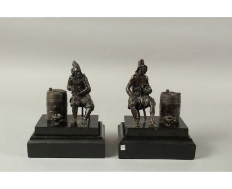 A RARE PAIR OF 18TH DUTCH BRONZE FIGURAL SMOKING COMPANIONS, in the manner of Pierre Xavery. Each depicts a seated tavern fig