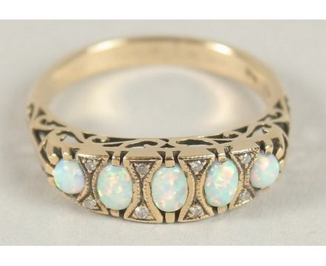 A 9CT GOLD OPAL AND DIAMOND RING.
