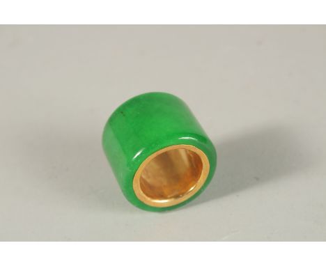 A JADE ARCHER'S RING.