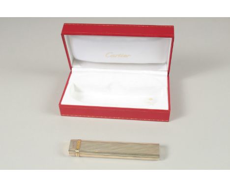 A GOOD CARTIER LONG LIGHTER. Stamped Cartier, Paris, No. 80873. 12.5cms long, in a Red Cartier Box.