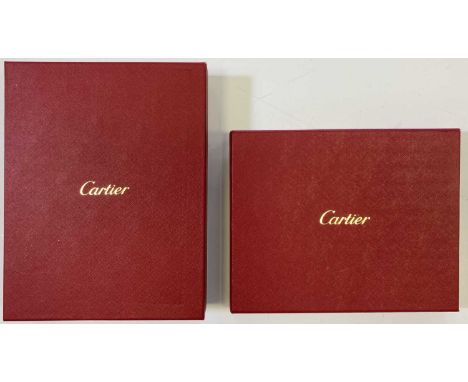 A ceramic tray by Cartier / Limoges with panther design, in original box. A pair of Cartier porcelain ashtrays in box. Excell