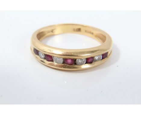 Gold (18ct) ruby and diamond half eternity ring in channel setting.  Ring size O CONDITION REPORT Weight 4.4 grams. London Im