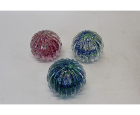 Three Caithness 'Optix' 1977 glass paperweights, made by Phillip Chaplin