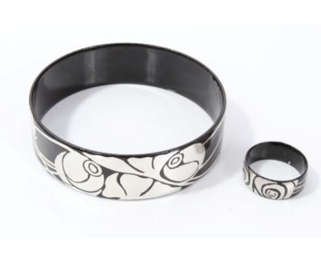 Black enamelled bangle with silver-coloured stylised rose decoration, together with a matching ring