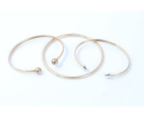 Two gold (9ct) torque bangles and one other gold (9ct) bangle (3) CONDITION REPORT Total weight approximately 13.4 grams