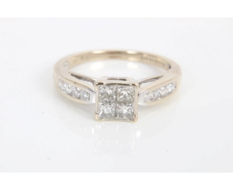 Diamond ring with a square cluster of four princess cut diamonds, flanked by eight channel set brilliant cut diamonds in whit