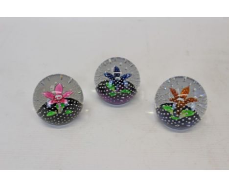 Three Caithness 'Petals' 1985 - 1989, paperweights, by Colin Terris