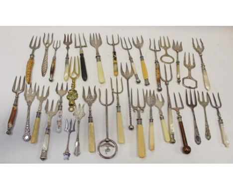 Collection of thirty-three Victorian bread forks - including some with mother of pearl handles, bone handles, etc
