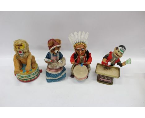 Vintage Cragston 'Crapshooter' battery-operated automaton, together with three others - Red Indian drummer circus lion and fe