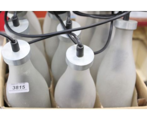 Modern design lamp by Tejo Remy for Simply Droog - comprising twelve milk bottles as it is in a Dutch milk crate, illuminated