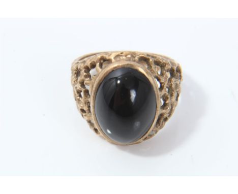 Gold (9ct) black onyx cabochon ring with abstract openwork shoulders.  Ring size R CONDITION REPORT Weight approximately 6.5 