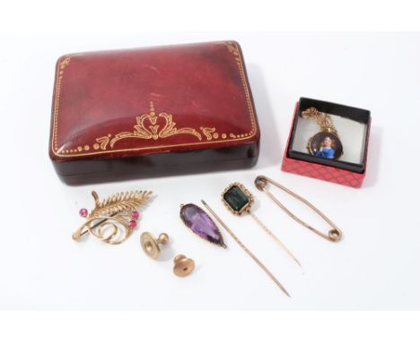 Gold (9ct) stylised leaf brooch set with three pink stones, gold (9ct) tie pin, two stick pins, two studs and a locket pendan